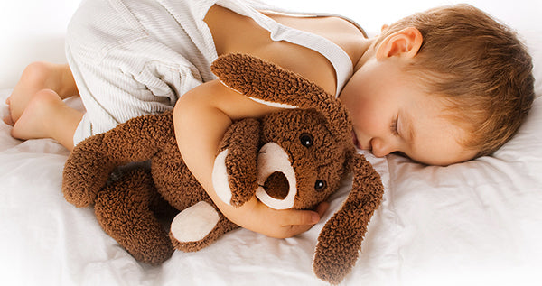 Baby sleeping peacefully in a crib