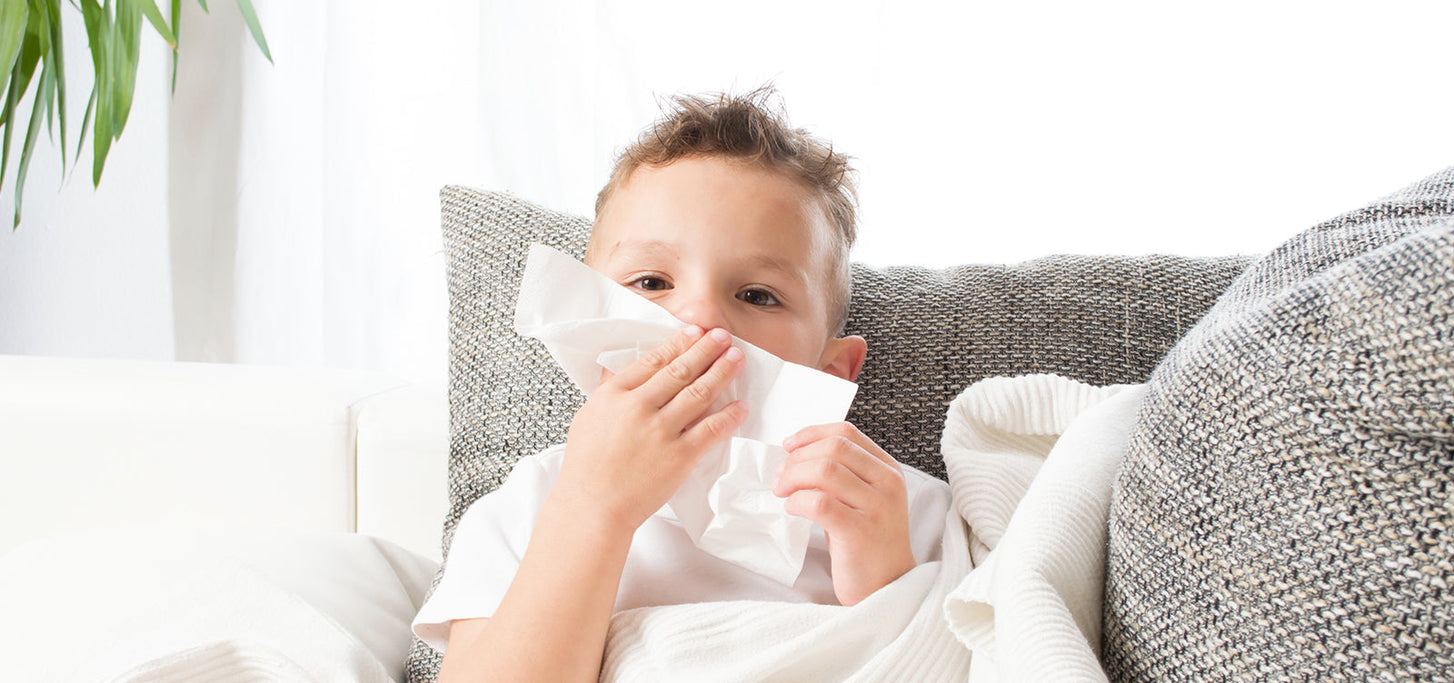 A parent comforting a coughing child